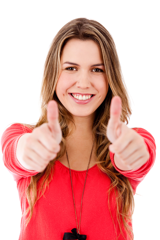 Woman with thumbs up - isolated over a white background
