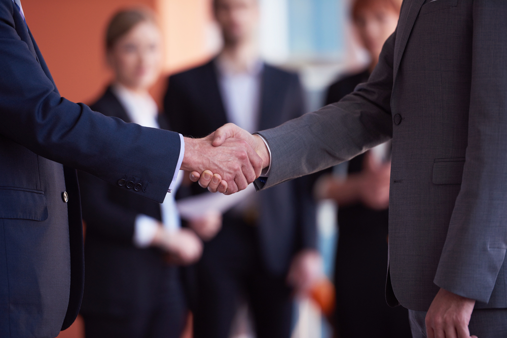 business partners, partnership concept with two businessman handshake